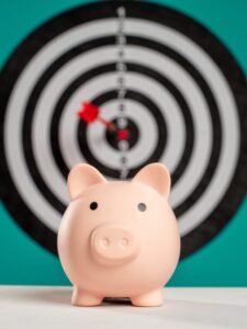 Background image of piggy bank and target